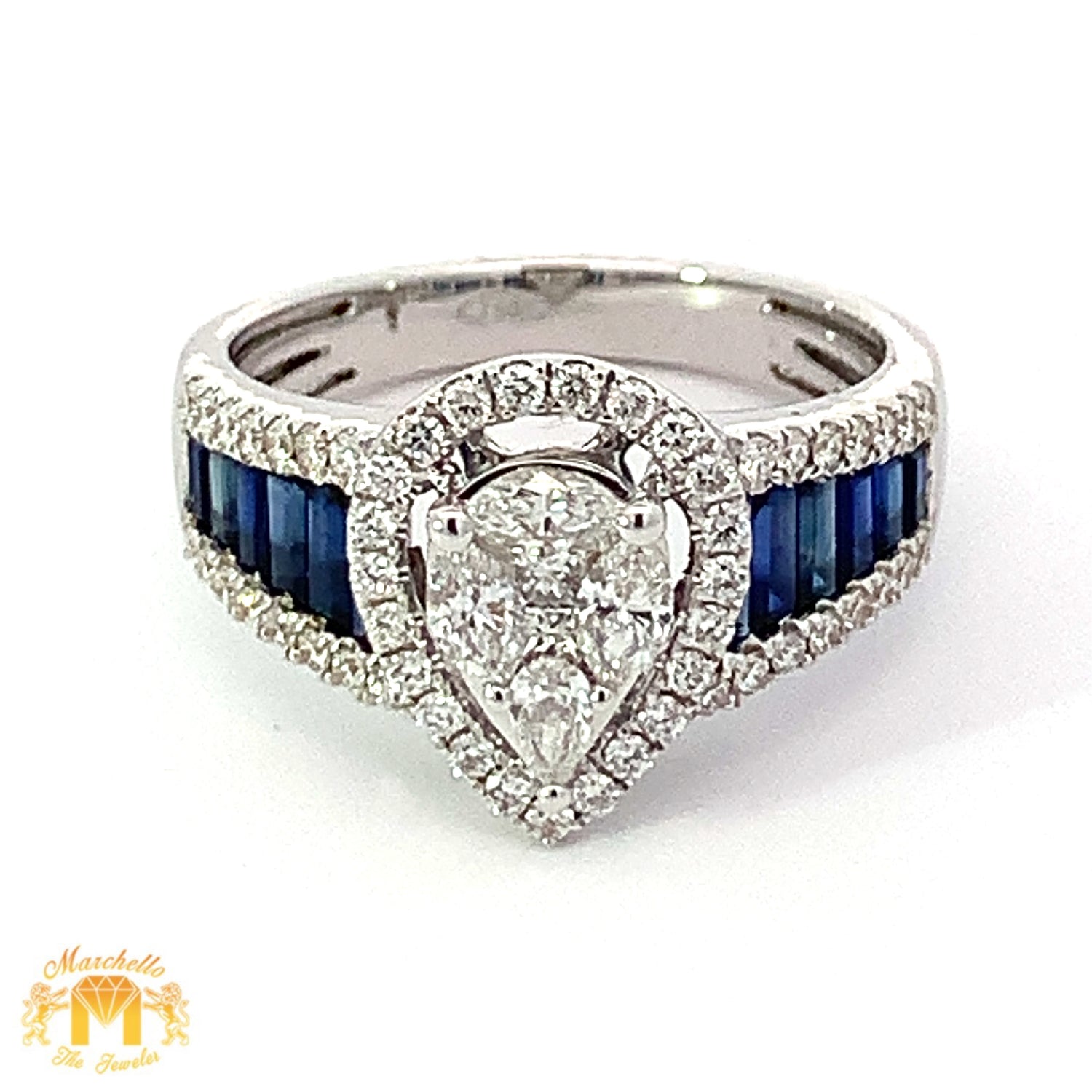 VVS/vs G color high clarity diamonds set in a 18k Gold Pear Shaped Ring with Blue Sapphire