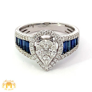 VVS/vs EF color high clarity diamonds set in a 18k Gold Pear Shaped Ring with Blue Sapphire