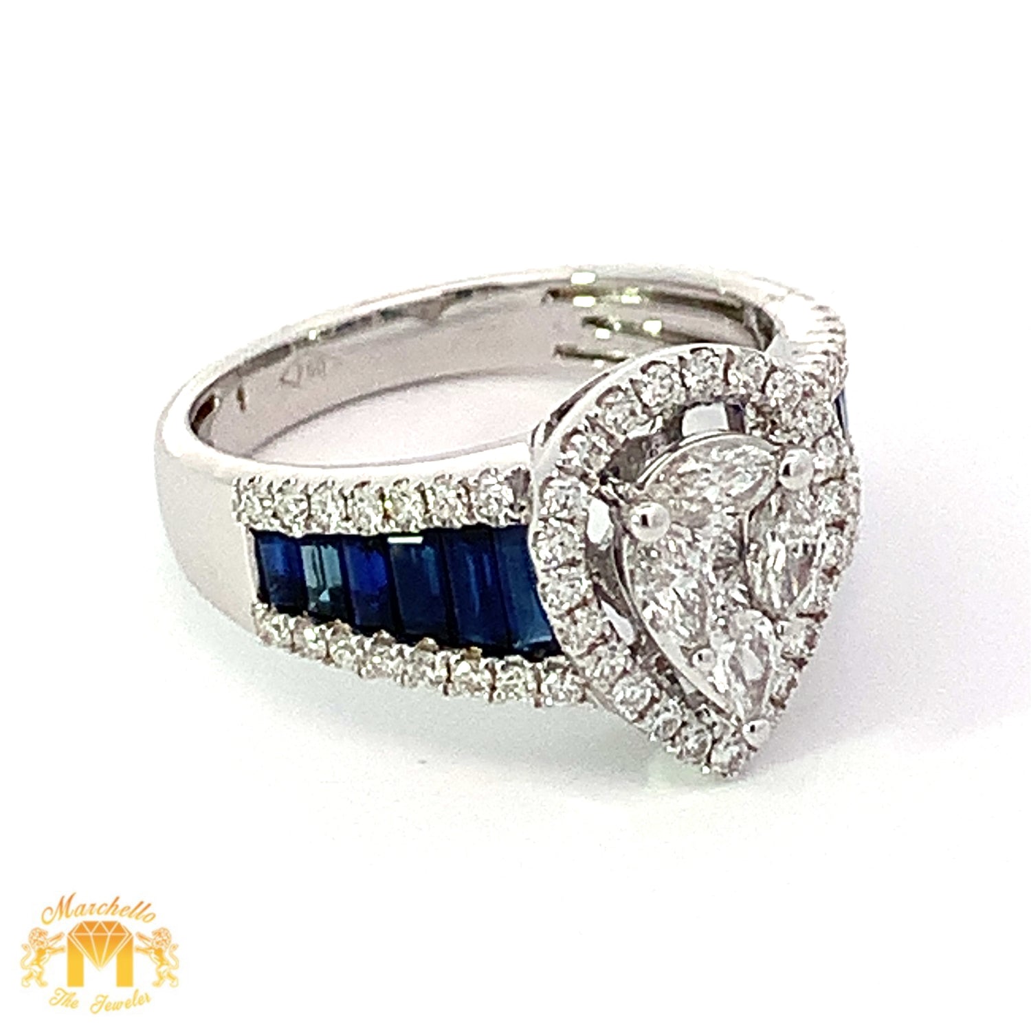 VVS/vs G color high clarity diamonds set in a 18k Gold Pear Shaped Ring with Blue Sapphire
