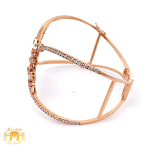 VVS/vs high clarity diamonds set in a 18k Gold Jasimine Bangle Bracelet with Baguette and Round Diamonds