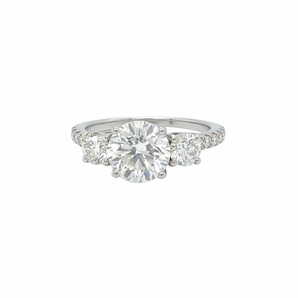 18k White gold three-stone engagement ring Natural diamonds.