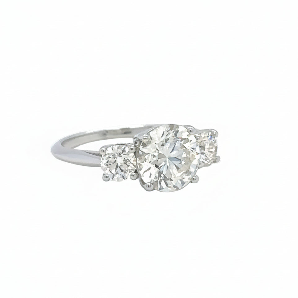 18k White gold three-stone engagement ring Natural diamonds.