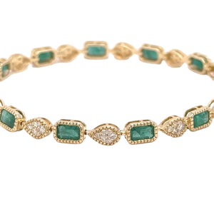 14k yellow gold and natural emerald and diamonds bracelet.