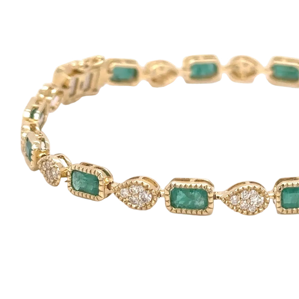 14k yellow gold and natural emerald and diamonds bracelet.