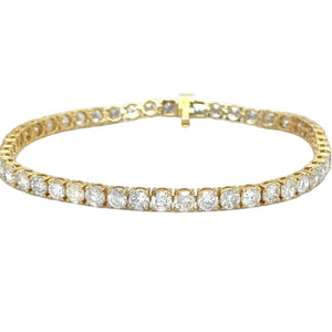 10k yellow gold and natural diamonds tennis bracelet.