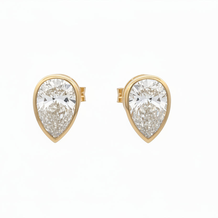 14k yellow gold and lab Pear shaped diamonds earrings.