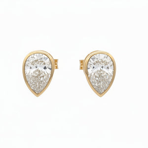 14k yellow gold and lab Pear shaped diamonds earrings.