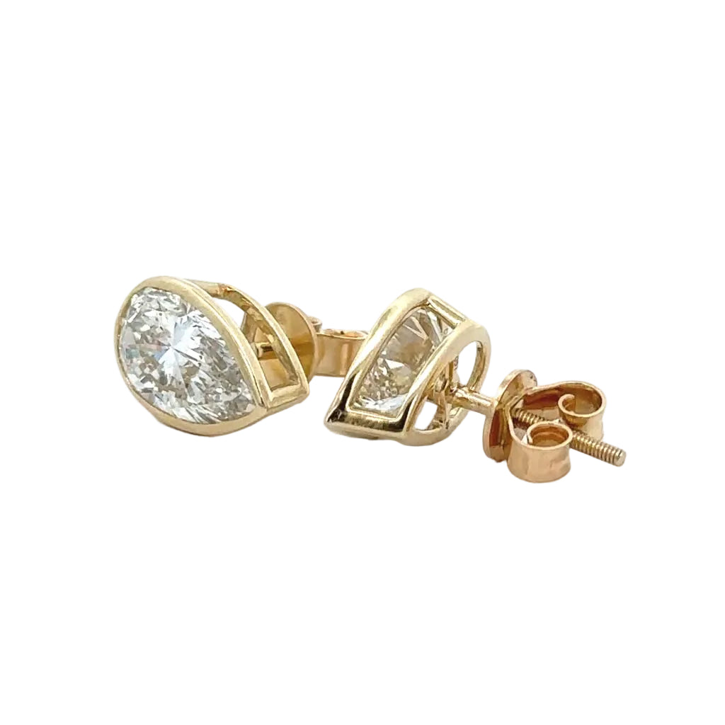 14k yellow gold and lab Pear shaped diamonds earrings.